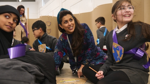 A woman sat with children