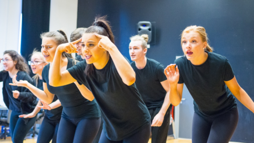 Female group of dancers in black outfits 