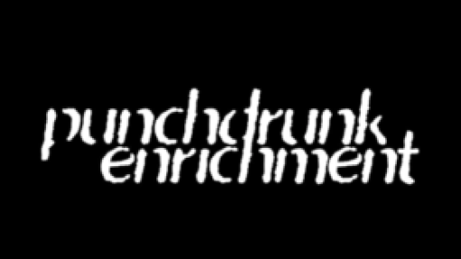 Stylized white text reading 'punchdrunk enrichment' on a black background, with a slightly distorted, wavy appearance.