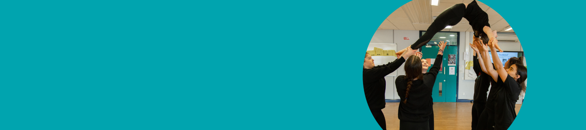 A turquoise banner with an image on the right of pupils dancing in a hall.