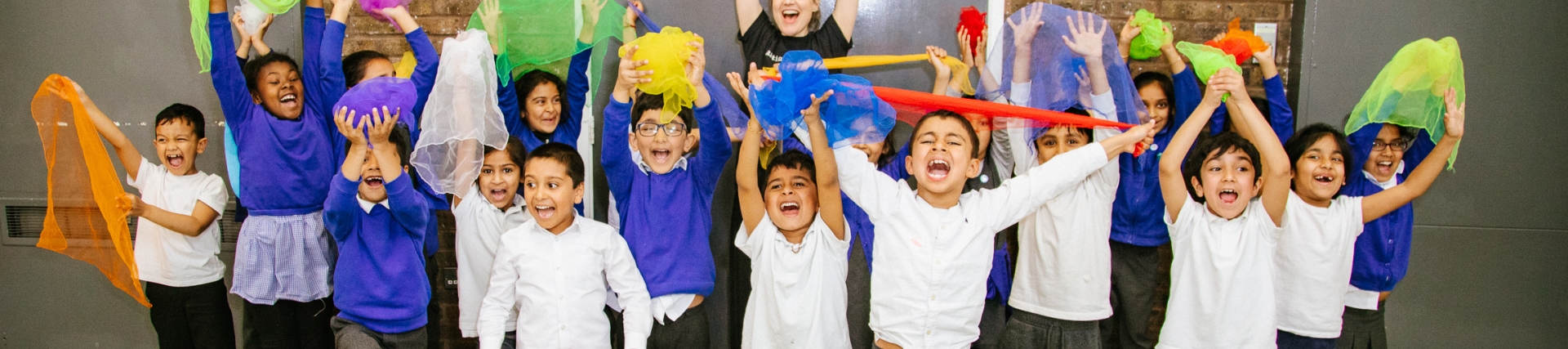 Pupils from Elmhurst Primary School group photo with Artsmark Parter, Artis 