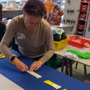 Teacher demonstration at a textile workshop