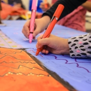 Newcroft - a young people's hands as they draw 