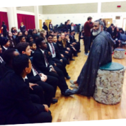 A group of students in a school hall. 