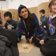 A woman sat with children
