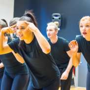 Female group of dancers in black outfits 